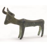 A Greek archaic style bronze figure of a bull, not ancient, standing four square with curved horn...