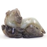 A Chinese jade model of a recumbent ram, 19th / 20th century, with turned head, horns and beard, ...