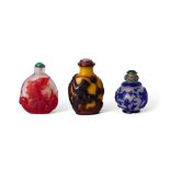 Three Chinese overlay glass snuff bottles, late Qing dynasty, 19th/20th century, one of spherical...
