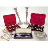 A group of silver, comprising: a pair of silver candlesticks, Birmingham, 1923, Fergenbaum & Son,...