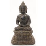 A Chinese bronze figure of a seated buddha, 19th century, with serene smiling face, closed eyelid...