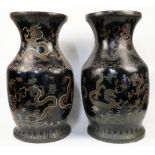 A pair of large Chinese black lacquer baluster vases, early 20th century, each decorated with dra...