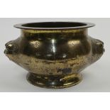 A Chinese bronze censer, 19th century, of compressed bombe form with everted rim and spreading ba...