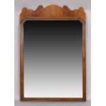 An English mahogany fret work mirror, George II style, first quarter 20th century, moulded surmou...