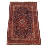 A Persian Sarouk rug, third quarter 20th century, the central floral medallion surrounded by flor...