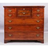 A George III and later mahogany secretaire chest, first quarter 19th century, the central drawer ...
