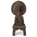 A Tibetan lacquered bronze figure of Shakyamuni Buddha, early 20th century, cast seated on two li...