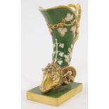 A Paris porcelain cornucopia vase, 19th century, modelled tapering to a ram's head with acanthus ...