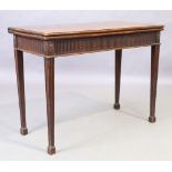 A George III mahogany tea table, last quarter 18th century, the fold over top above stop fluted f...