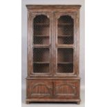 John Richard, an oak linen cupboard, in the French style, late 20th century, with two wire mesh p...