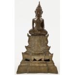 A Burmese bronze buddha, 19th century, depicted with serene smiling face, closed eyelids, and elo...