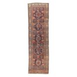 A Caucasian Kazak long rug, first quarter 20th century, the central field with five geometric med...