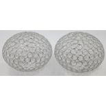 A pair of modern metal framed ceiling light shades, 21st century, of compressed spherical form, t...