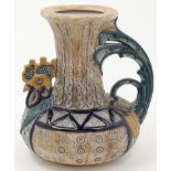 Amphora Pottery, a jug in the form of a cockerel, c.1906-12, the underside impressed with Imperia...