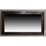 A large contemporary wenge mirror, thick mahogany veneered frame set with bevelled glass plate, 2...