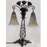 After a design by Edgar Brandt, a wrought metal table lamp, second half 20th century, decorated w...