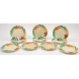 A set of ten Clarice Cliff porcelain plates, 20th century, each with moulded and naturalistically...