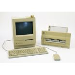 An Apple Macintosh Classic II, 1991, model no. M4150, FCC ID BCGM4150, with various accessories i...