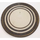 Sarah Perry, British, 1945-2021, a stoneware charger, designed with concentric rings, artist's mo...