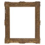 A French Carved and Gilded Louis XIV Style Frame,  early 19th century-  with schematic leaf sig...