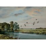 Elizabeth Gray,  British 1928-2022 -  Ducks in flight over a lake;  watercolour on paper, signe...