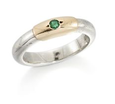 Lalaounis. A single stone emerald stacking ring, the round-cut emerald grain set to the two colou...