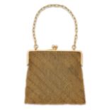 A 9ct gold mesh link evening bag, with 9ct gold cable link carrying chain and a snap clasp, the m...