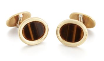 Piaget. A pair of tiger's eye cufflinks, oval bezel-set tiger's eye tablets to swivel fittings, s...