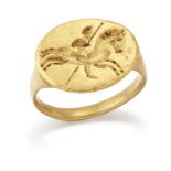 A 19th century gold ring, in the style of an ancient Greek intaglio ring engraved to depict a mou...