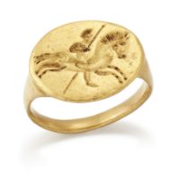 A 19th century gold ring, in the style of an ancient Greek intaglio ring engraved to depict a mou...