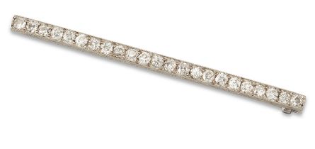 An early 20th century platinum diamond bar brooch, with a row of old brilliant-cut diamonds, grai...