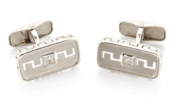 A pair of diamond set cufflinks, rectangular panels each collet set with a princess-cut diamond, ...