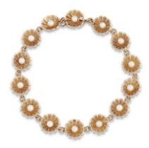 Cropp & Farr. A 9ct gold seed pearl bracelet, the links of flowerhead design each set with a sing...