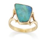 An 18ct gold boulder opal ring, by Leisha Wheeler, the freeform boulder opal bezel set to split s...