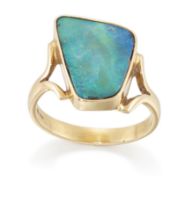 An 18ct gold boulder opal ring, by Leisha Wheeler, the freeform boulder opal bezel set to split s...