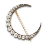 A Victorian diamond crescent brooch, designed as a graduated line of old-brilliant-cut and rose-c...