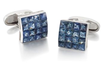 A pair of 18ct white gold sapphire cufflinks, the slightly curved panel with a grid of invisibly ...