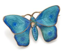 Child & Child. An Edwardian silver gilt and enamel butterfly brooch, the wings and body of tones ...