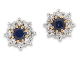 A pair of 18ct gold sapphire and diamond cluster earrings, each with a round mixed-cut sapphire c...