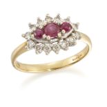 An 18ct gold ruby and diamond cluster ring, designed with three circular cut rubies to an oval br...