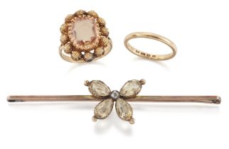 A small group of jewellery, comprising: a pale orange topaz cluster, circa 1820, later mounted as...