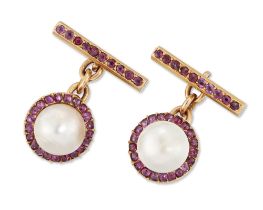 A pair of mabé pearl and ruby cufflinks, circular panels with a mabé pearl and ruby cluster, to o...