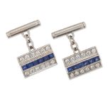 A pair of sapphire and diamond-set cufflinks, the rectangular panels with a central row of step-c...