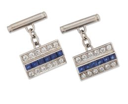 A pair of sapphire and diamond-set cufflinks, the rectangular panels with a central row of step-c...