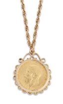 A George V sovereign, 1914, spectacle set to a 9ct gold pendant mount, London hallmarks, 1969, su...