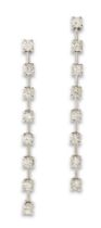 A pair of diamond drop earrings, a series of brilliant-cut diamonds with articulated bars between...