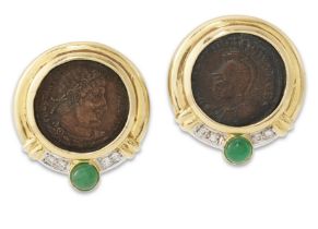 A pair of emerald and diamond-set Roman coin earclips, each mounted with a Roman bronze coin of C...