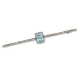 An aquamarine and diamond bar brooch, the claw-set rectangular mixed cut aquamarine to single-cut...