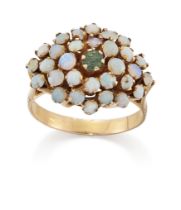 An emerald and opal cluster ring, the round cut emerald to surround of cabochon opals, claw-set, ...