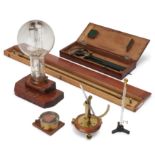 A group of maritime and scientific instruments, to include a lighthouse lightbulb, 20th century, ...